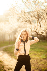 fotography of a girl in nature. Blooming trees. Apricots