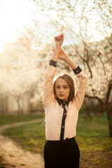 fotography of a girl in nature. Blooming trees. Apricots