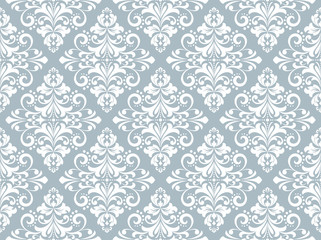 Wallpaper in the style of Baroque. Seamless vector background. White and blue floral ornament. Graphic pattern for fabric, wallpaper, packaging. Ornate Damask flower ornament