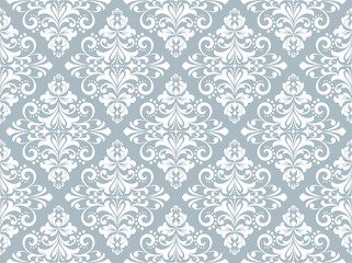 Wallpaper in the style of Baroque. Seamless vector background. White and blue floral ornament. Graphic pattern for fabric, wallpaper, packaging. Ornate Damask flower ornament