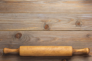rolling pin at wooden board rustic plank table