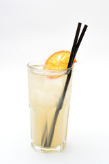 lemonade with a slice of dried orange in a transparent glass on a white background
