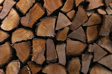Stack of cut wood. Felled timber background. Wooden interior.