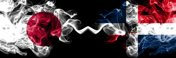 Japan vs Dominican Republic smoky mystic flags placed side by side. Thick colored silky smokes combination of Dominican Republic and Japanese flag