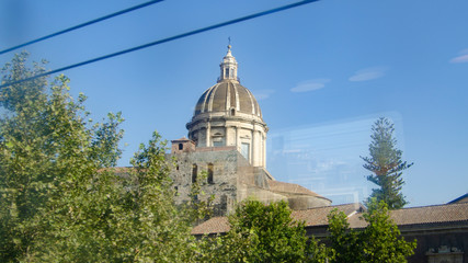 Dome of the cathedral of Catania photographed from the train