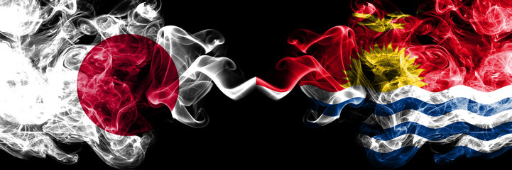 Japan vs Kiribati smoky mystic flags placed side by side. Thick colored silky smokes combination of Kiribati and Japanese flag