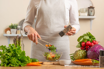 Chef peppers fresh and bright salad close-up, on a light background. The concept of losing healthy...