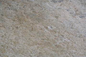 A surface of a architectural stone.( gray, white pink, brown and black. rough)