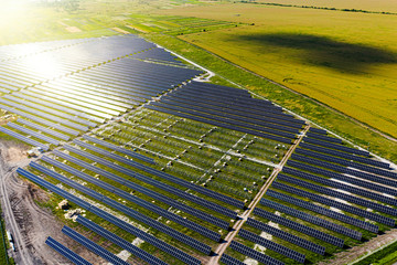 New energy. Solar panels in aerial view. Pepairing solar panel at generating power of solar power...