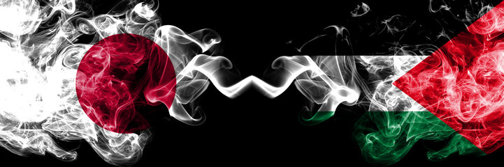 Japan vs Palestine, Palestinian smoky mystic flags placed side by side. Thick colored silky smokes combination of Palestine, Palestinian and Japanese flag