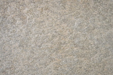 A surface of a architectural stone.(white, gray, pink and blue. rough)