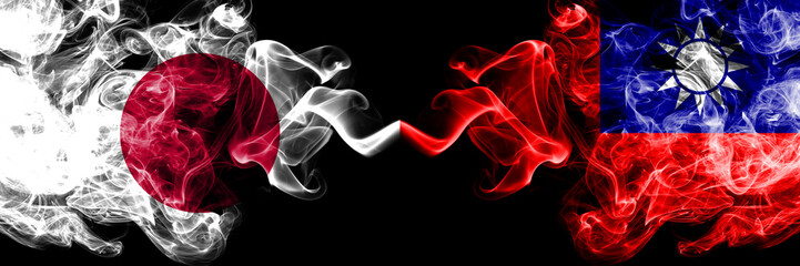 Japan vs Taiwan, Taiwanese smoky mystic flags placed side by side. Thick colored silky smokes combination of Taiwan, Taiwanese and Japanese flag