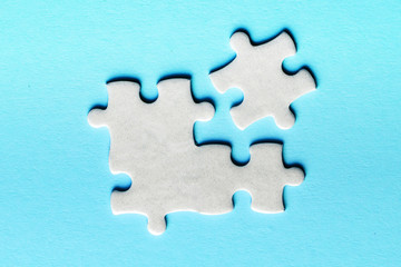 White details of puzzle on a blue background