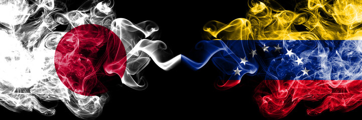 Japan vs Venezuela, Venezuelan smoky mystic flags placed side by side. Thick colored silky smokes combination of Venezuela, Venezuelan and Japanese flag
