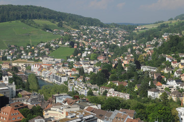 Fototapeta na wymiar Switzerland: The view to the old town of Baden City and Ennetbaden in canton Aargau from the chateau above