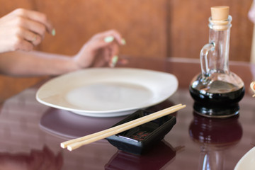 served table in a cafe with empty plates. Preparing for lunch, waiting for food.