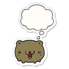 funny cartoon bear and thought bubble as a printed sticker