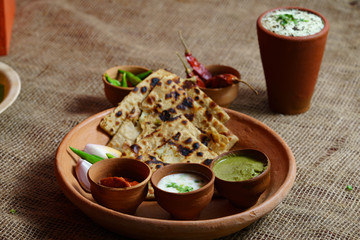 Methi Paratha - A flatbread stuffed with fenugreek leaves and spices
