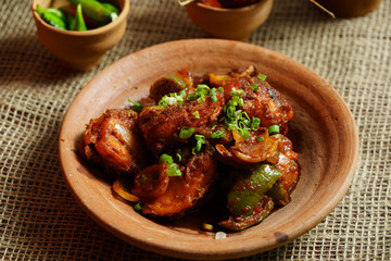 Chilli egg or Spicy cottage cheese, served with capsicum and onion, favourite indian starter menu