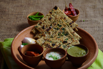 Methi Paratha - A flatbread stuffed with fenugreek leaves and spices