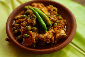 Mutter Paneer , Indian Dish Cottage cheese and Peas immersed in an Onion Tomato Gravy