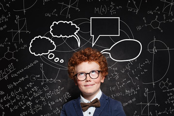 Happy child student with speech bubble cloud and science formulas