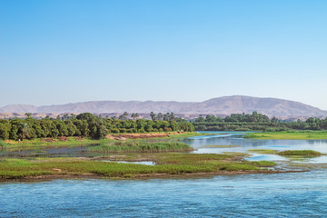 Armant Island with mountains in the background, near Luxor