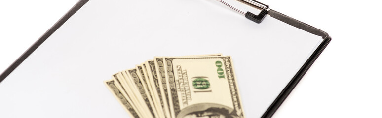 panoramic shot of dollar banknotes and empty clipboard isolated on white