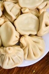 Khinkali, Georgian dumplings, traditional Georgian cuisine. Khinkali on a plate side view.