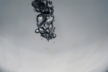 swirl of bubbles in the water. monochrome background.