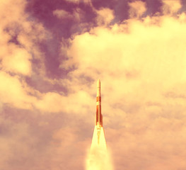 Rocket and clouds. Taking off from ground, lift off. The elements of this image furnished by NASA.