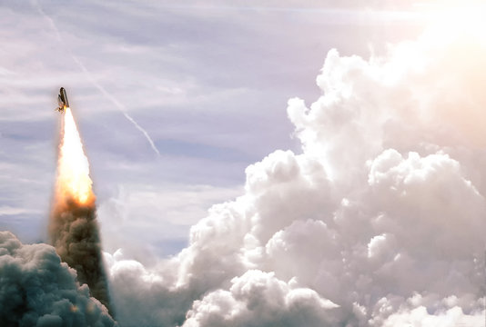 Space Launch System Takes Off into deep space. Launch with dust and smoke. Elements of this image furnished by NASA. - Powered by Adobe