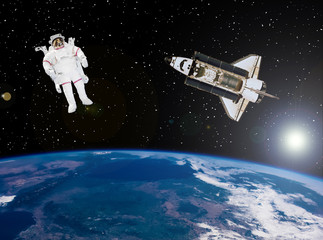 Space shuttle is going on mission. Astronaut in the outer space. The elements of this image...