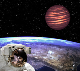 Astronaut staring at the exoplanet. Scene above earth. The elements of this image furnished by NASA.