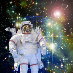Naklejka premium Astronaut and space, galaxies and stars. The elements of this image furnished by NASA.