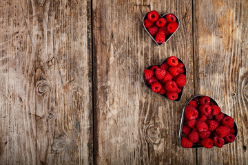 Ripe raspberries in the shape of a heart