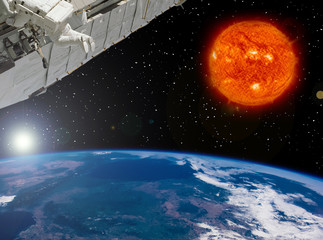 Big sun and spaceship. Earth from space. The elements of this image furnished by NASA.