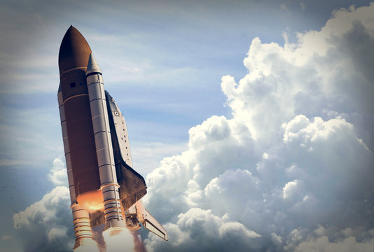 Rocket launch into dramatic sky. The elements of this image furnished by NASA.