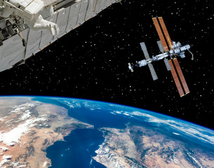 Space station and spaceship above the earth. The elements of this image furnished by NASA.