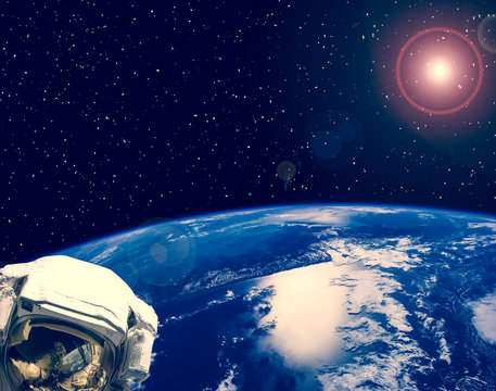 Astronaut and earth on the backdrop. The elements of this image furnished by NASA.