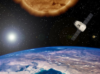 Big sun and space satellite. Earth from space. The elements of this image furnished by NASA.