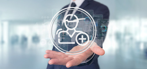 Businessman holding new contact icon