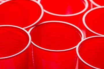 Rows of red drinking cups. Conceptual poster. Zero waste plastic free ocean nature pollution environmental conservation concept. Design template with copy space