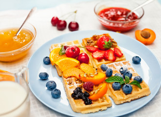 fresh fruits with crispy waffles and powder sugar