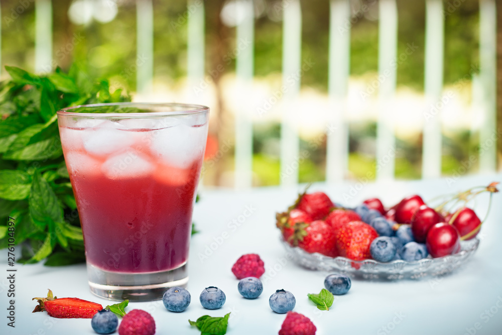 Wall mural Juice of various fresh summer berries