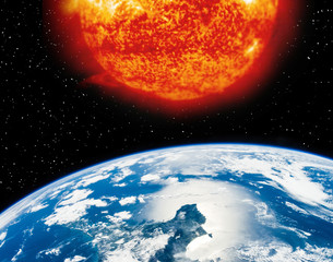 Fototapeta premium Earth planet and burning sun above it. The elements of this image furnished by NASA.