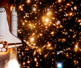 Rocket (shuttle) and galaxy. The elements of this image furnished by NASA.