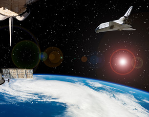Shuttle flies in space. Other spaceship goes anywhere.  The elements of this image furnished by...