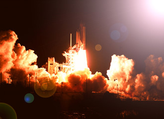 Cloudy rocket launch. The elements of this image furnished by NASA.