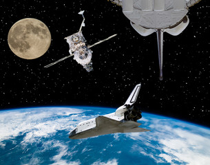 Shuttle, moon and spaceships. The elements of this image furnished by NASA.